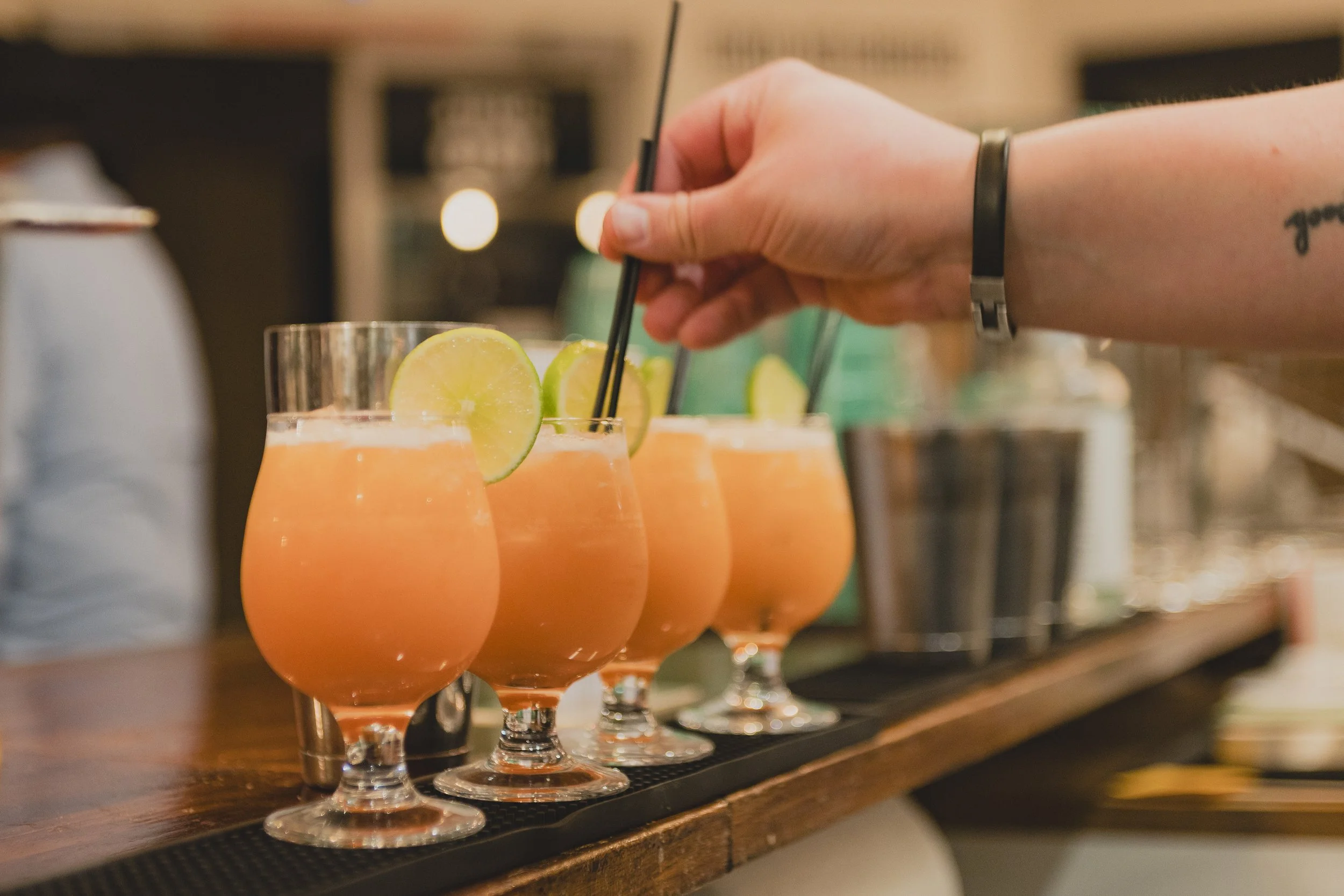 Cocktails lined up on a counter