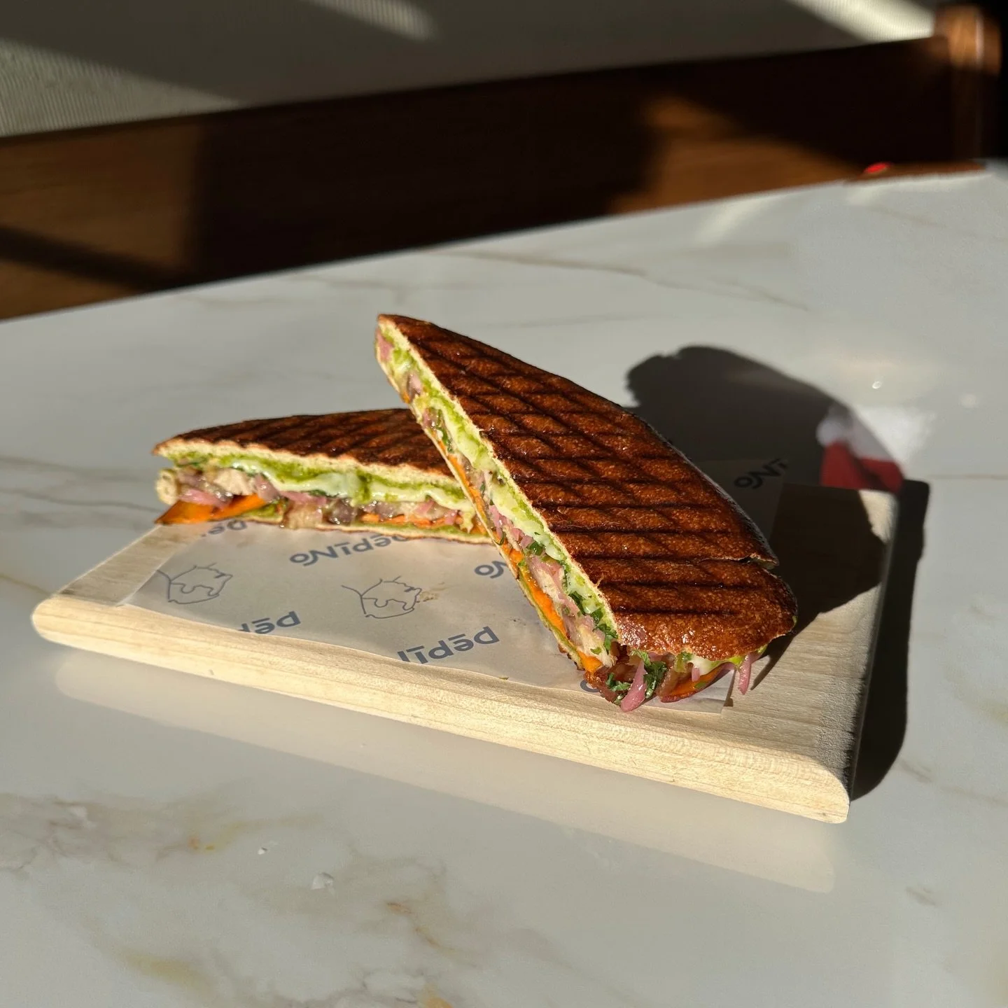 @brianmalarkey knows a good sammy! Our pork belly Pan con Chicharron sandwich is layered with goodness like thinly sliced sweet potatoes, pickled onion, and our signature salsa verde. Served on bread we make right here at Pepino.