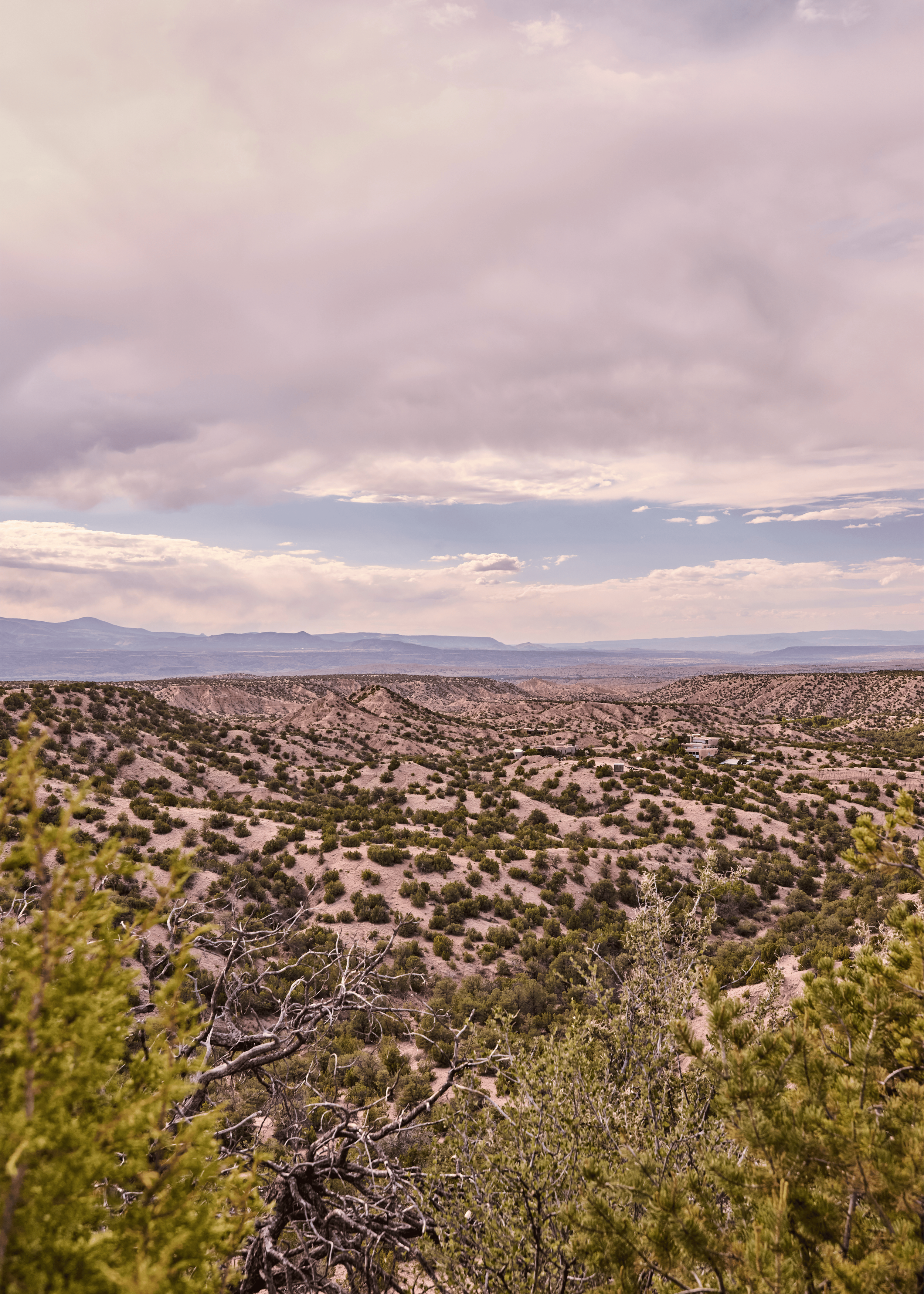 The view from the Mesa Project: the high desert of Tesuque, New Mexico stretching toward the Sangre de Cristo Mountains. Every design decision French & French Interiors made inside this home was in conversation with this landscape.