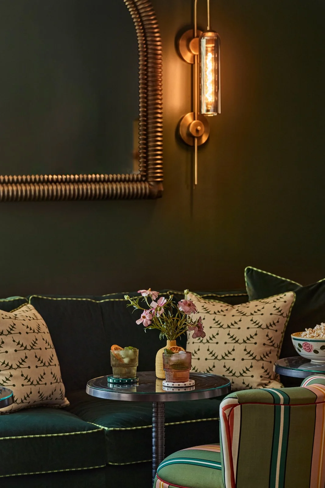 A moody, high-end interior in Santa Fe with custom drapery, sculptural lighting, and tailored seating. This residential lounge draws from boutique hospitality design, creating an intimate and immersive environment for entertaining and relaxation.