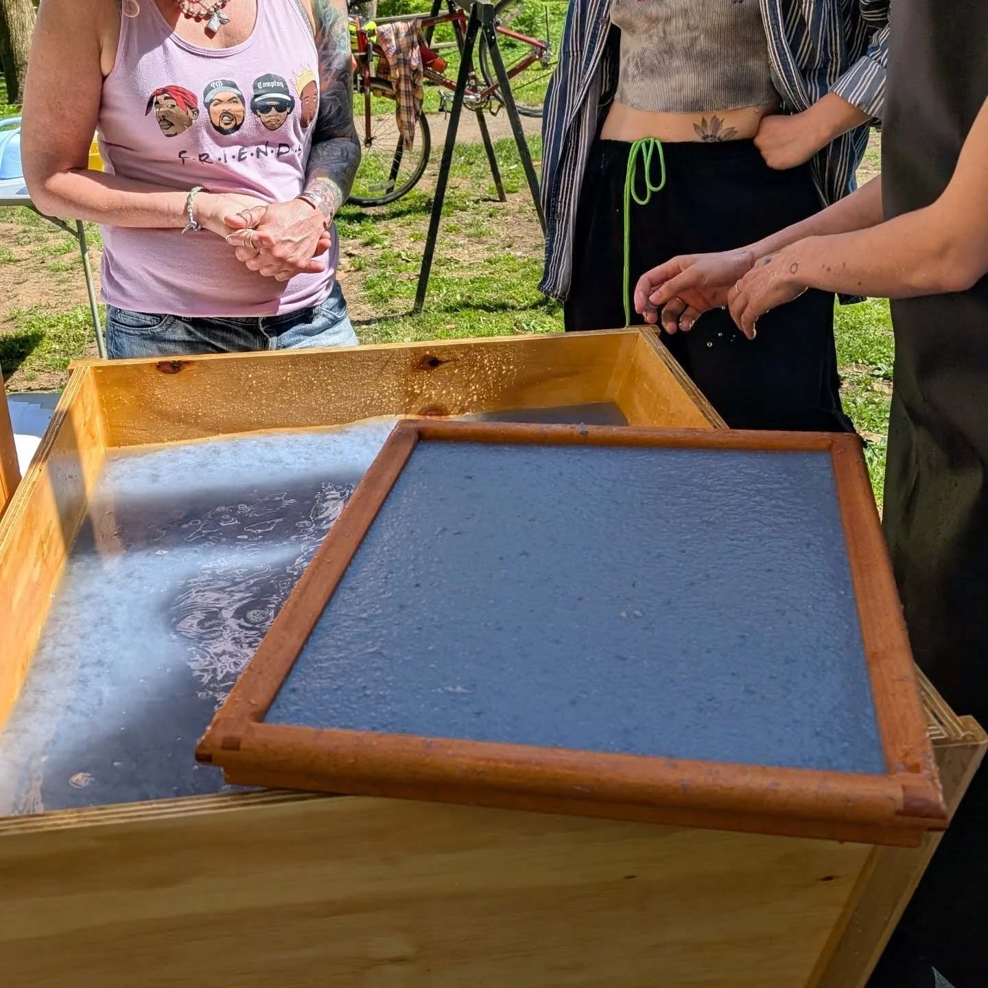 At work, I'm doing a program that includes an exploration of how paper was made in 1776 and this is the first sheet of paper made from pulp from a community rag collection (community makes blue paper!) with our new vat made by a local carpenter and o