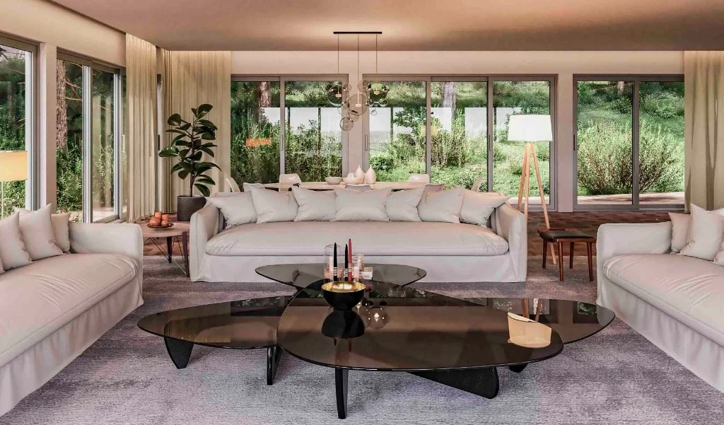 Luxury open-plan living room in a Girona forest retreat, featuring floor-to-ceiling windows with woodland views, contemporary oversized sofas, and smoked glass coffee tables by Sebastian PM.