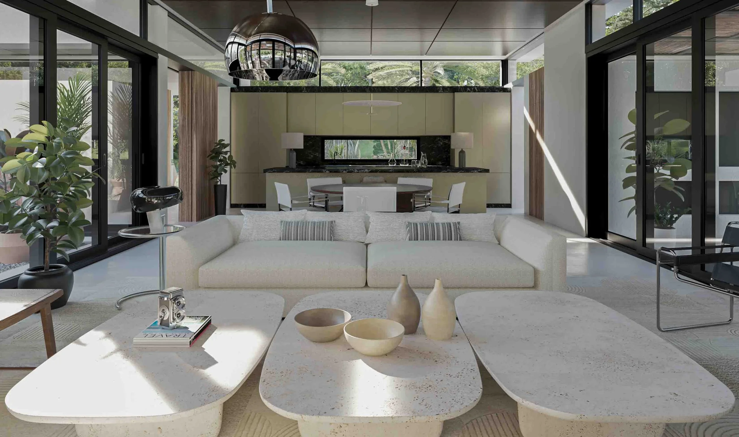 Sophisticated luxury open-plan living room and dining area with bespoke contemporary furniture, a white sofa, and unique textured stone coffee tables in a light-filled Mallorca villa, designed by Sebastian PM.