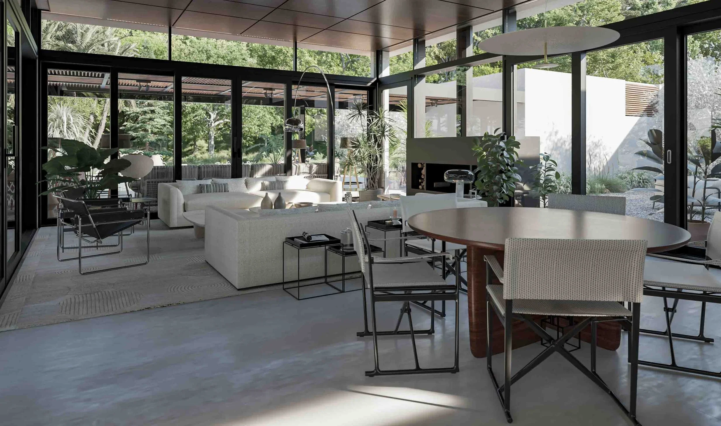 Sophisticated luxury living and dining room with bespoke contemporary furniture, a round wooden dining table, and large glass walls overlooking a Mediterranean garden in Mallorca