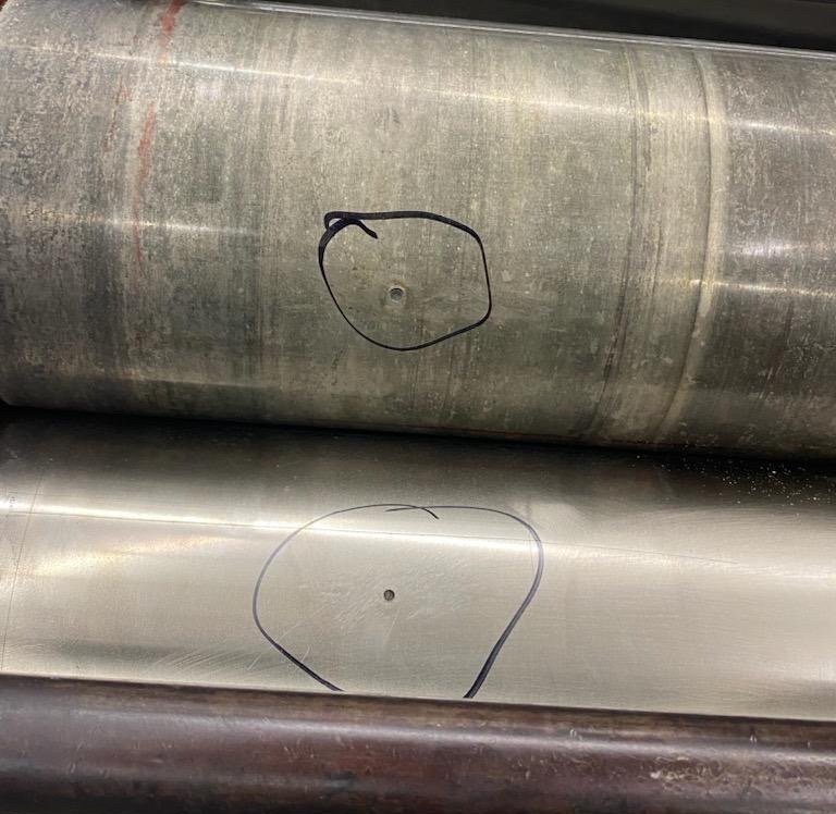 Bearing divots on two surfaces