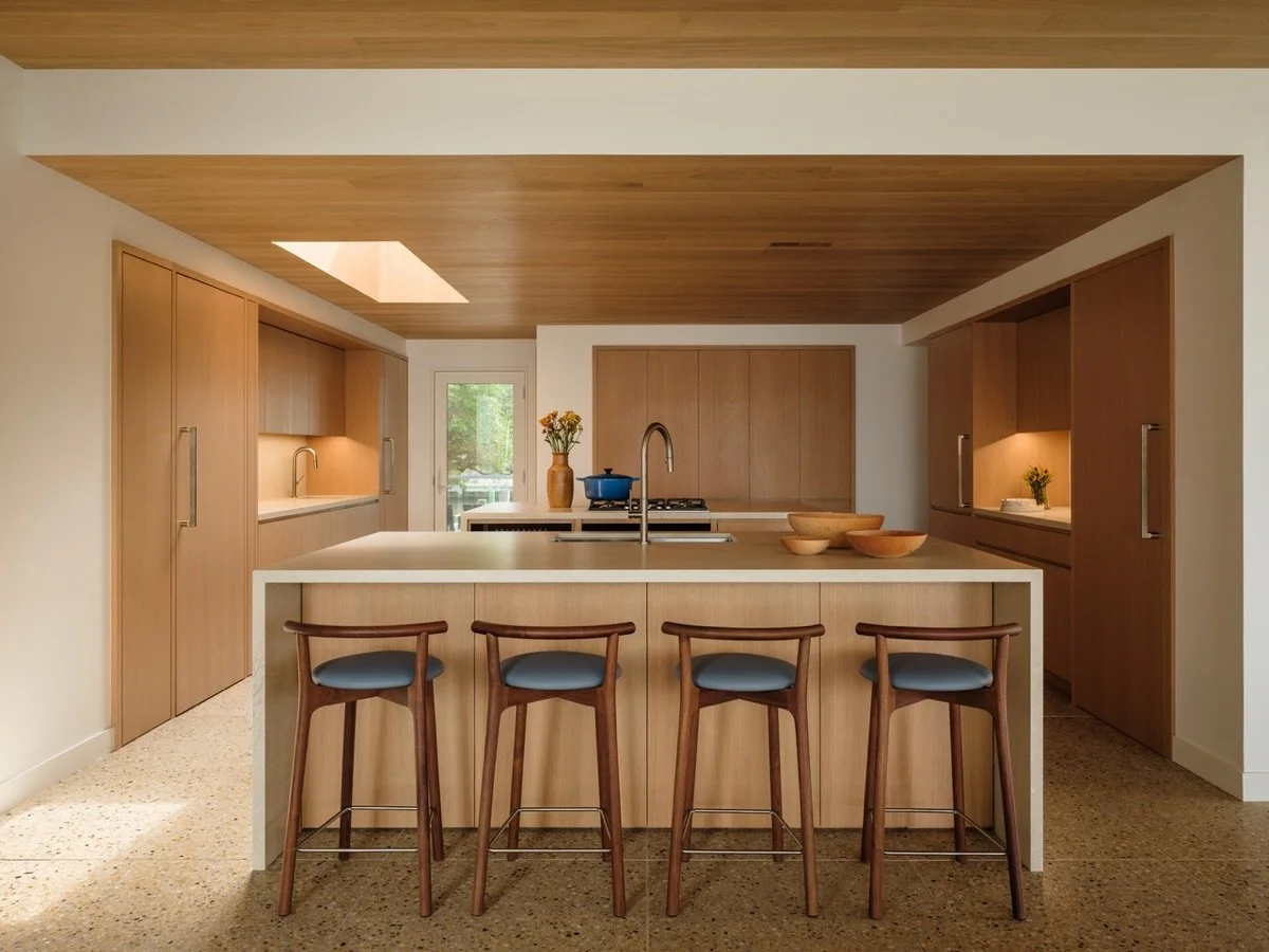 At our Duneway #fireisland project - we reorganized the kitchen into a double island configuration, providing increased circulation pathways and flow. The materials bring in warmth and character while a new skylight adds natural light. Doors to an of