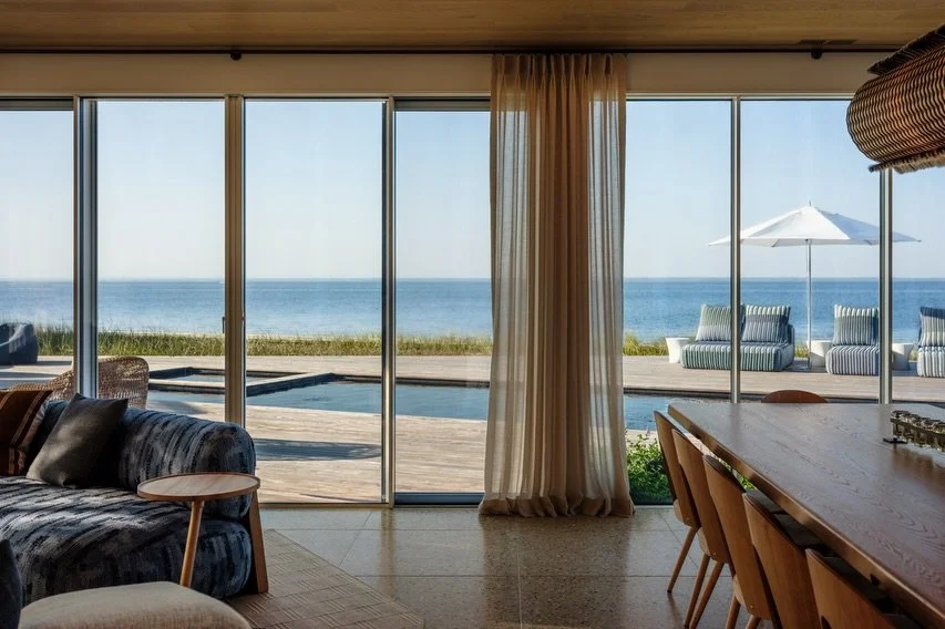 We maximized the views of the bay from our Duneway #fireisland project by replacing a large portion of the facade with sliding doors with minimal frames. Water became another material, emphasized by re-lining the pool dark and further connecting the 