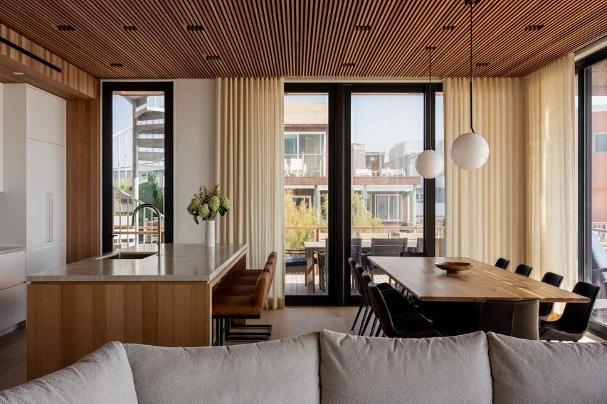 For the interior of our Surf Road house, we created continuity with the awning outside using a mahogany slat ceiling while mahogany boards bring more of the signature #fireisland character and warmth to inside. White walls and cabinets balance all th