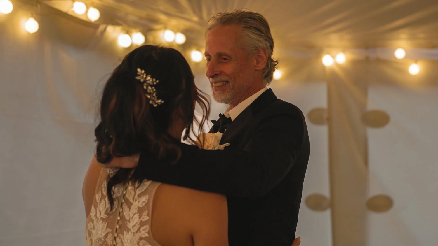 Bride dancing with family during reception