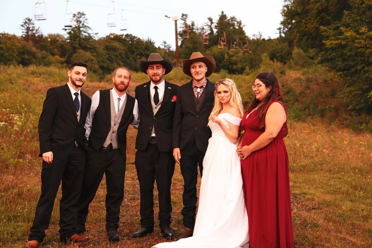 Wedding party portrait outdoors in the mountains