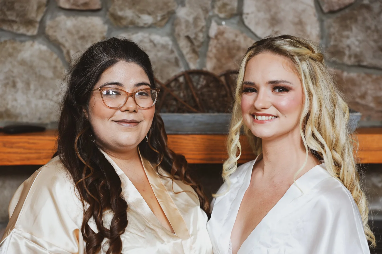 Bride getting ready with member of wedding party