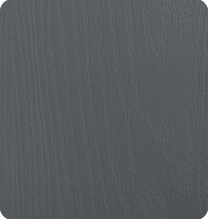 Close-up of a textured, dark gray surface, possibly wood or painted material.