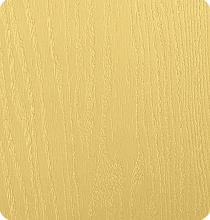 Close-up of a light yellow textured wooden surface.