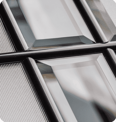 Close-up of window screens and window frame with mesh screens.