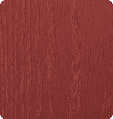 Close-up of a red wooden surface with visible wood grain patterns.