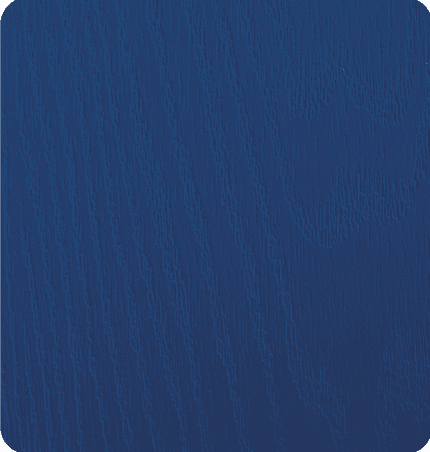 Close-up of a textured, painted wooden surface in dark blue.