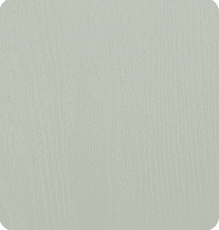 A plain, light-colored surface with a subtle wood grain texture.