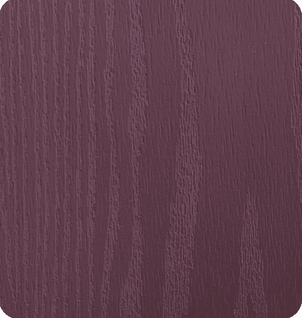 Close-up of a textured pinkish-purple wooden surface.