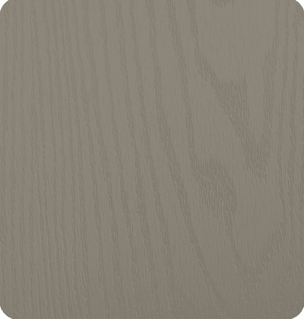 Close-up of a light gray wooden surface with visible grain patterns.