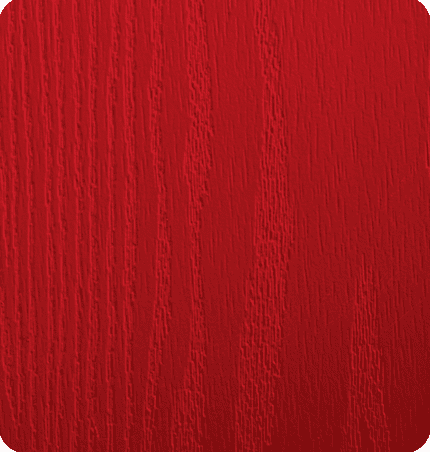 Close-up of a red textured surface, likely painted wood.