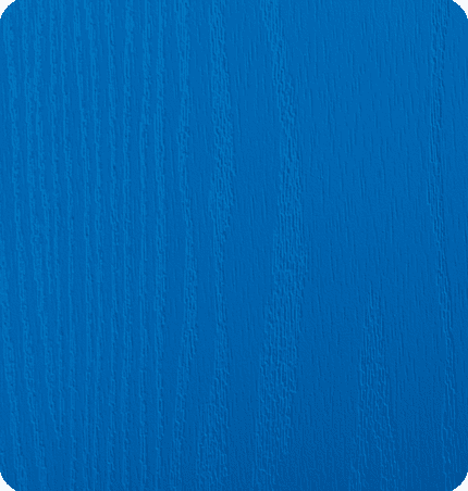 Close-up of a textured blue surface with a round corner.
