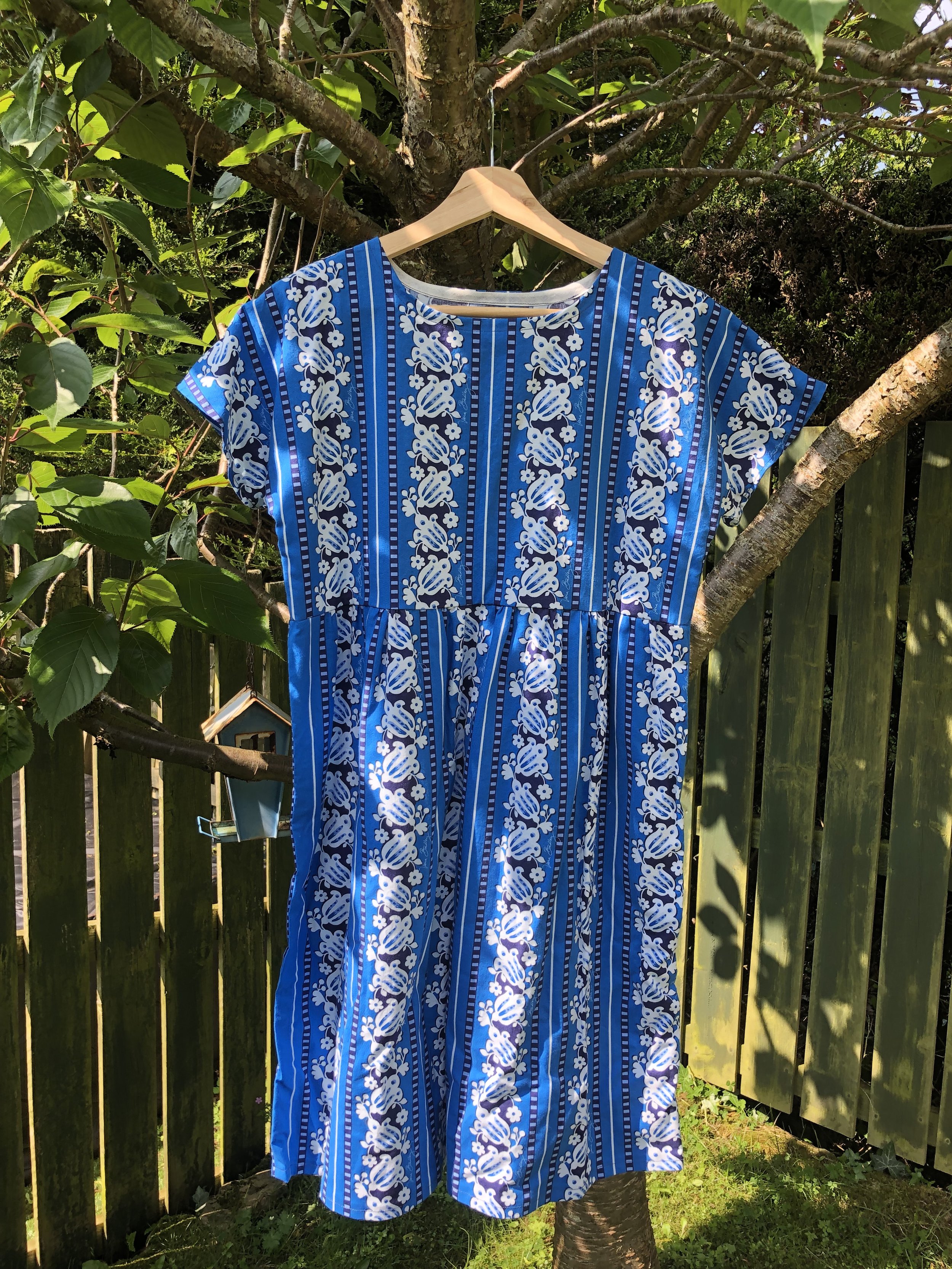Repurposed fabric dress, blue stripes and flowers. A bespoke dress which has been handmade from repurposed fabric with a beautiful blue stripes and flowers pattern.