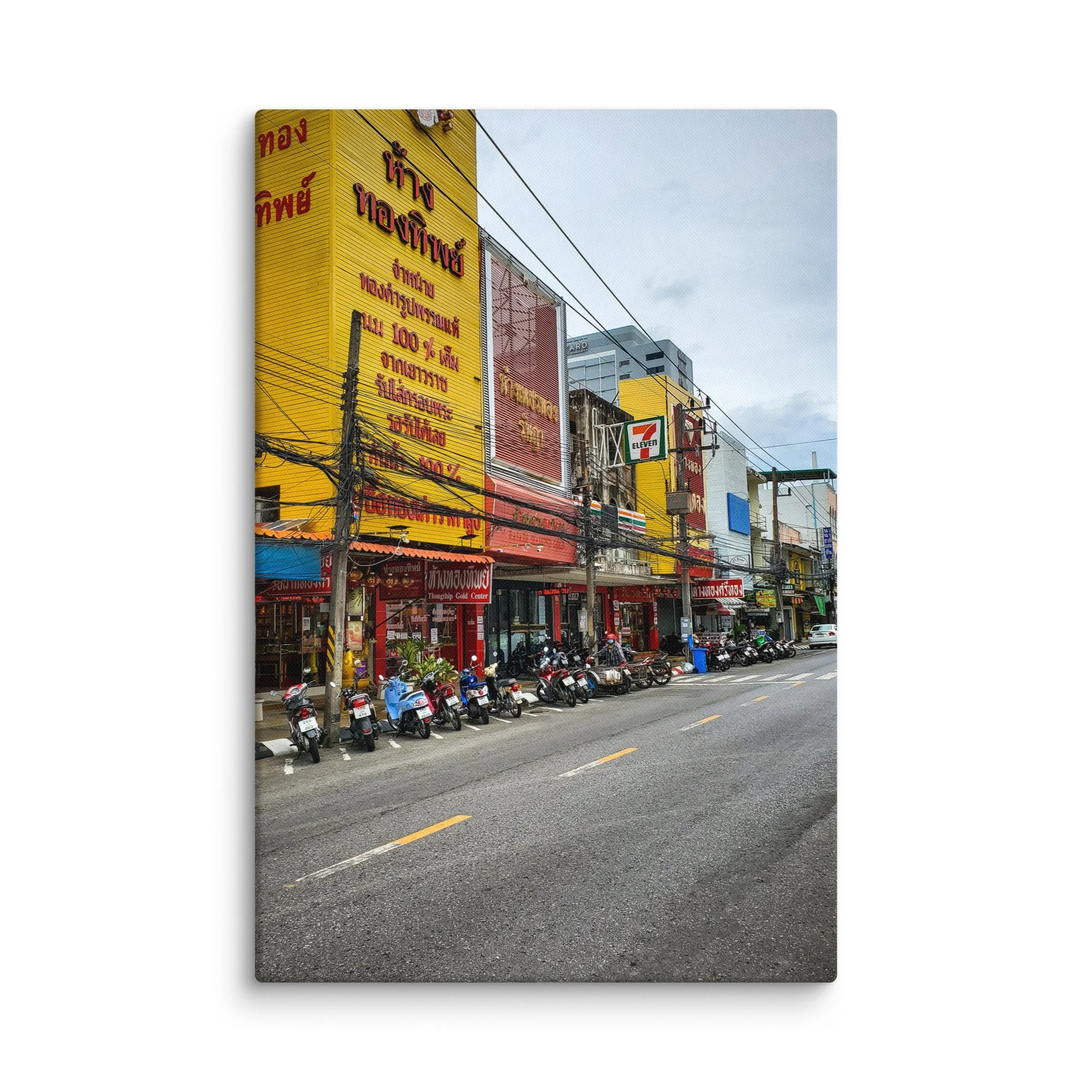 Vibrant Thai street with gold shops, colorful buildings, parked scooters and overhead wires – authentic Thailand travel photography canvas print wall art decor