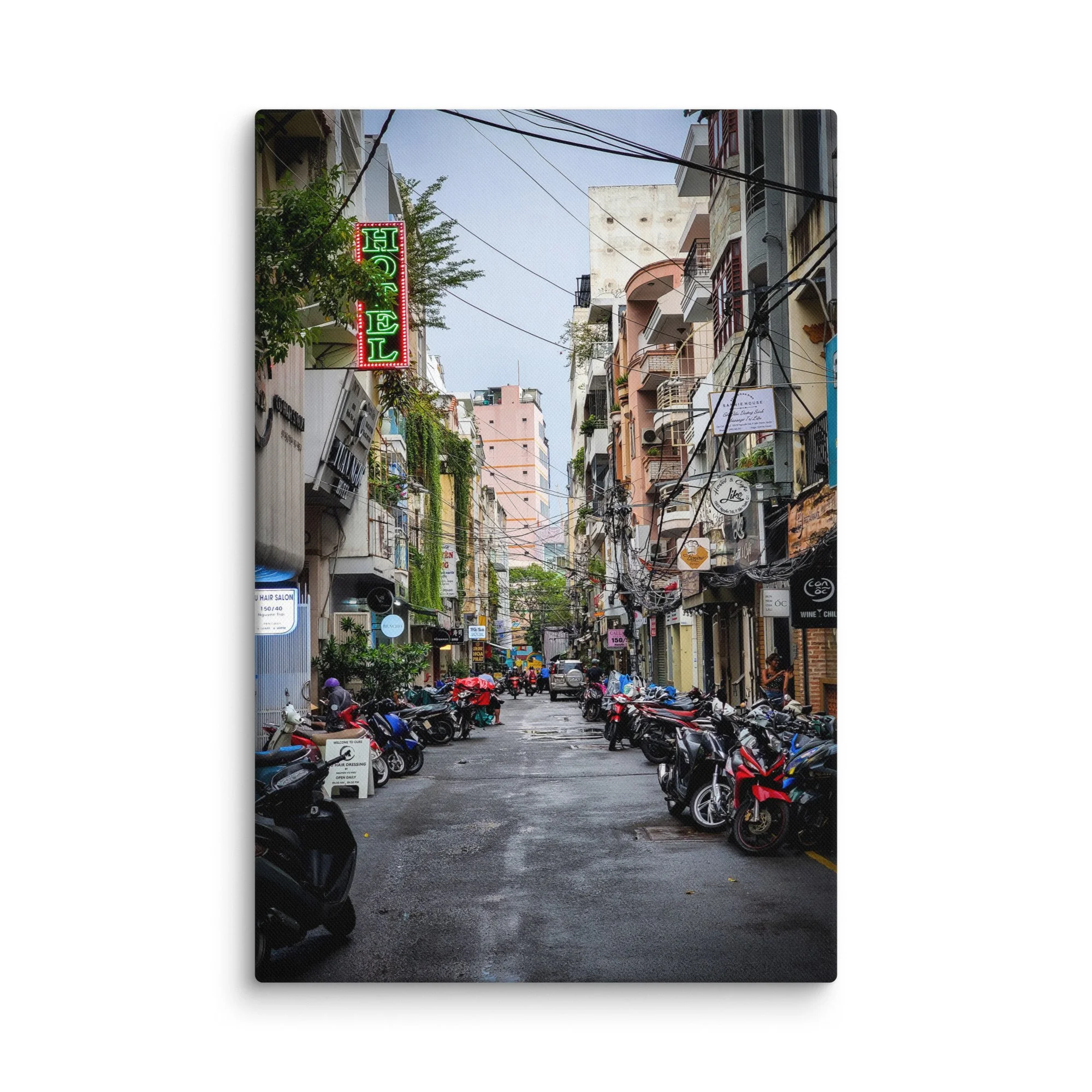 Atmospheric Hanoi Old Quarter narrow alley with neon hotel sign, vines, scooters and colorful buildings – authentic Vietnam travel photography canvas print wall art decor