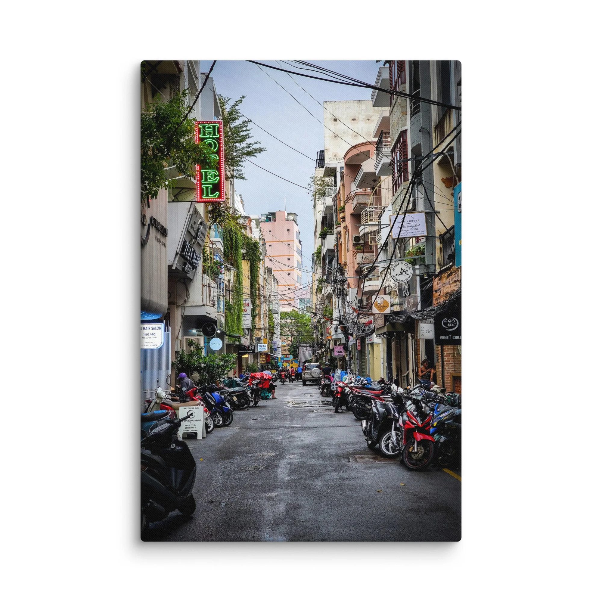 Atmospheric Hanoi Old Quarter narrow alley with neon hotel sign, vines, scooters and colorful buildings – authentic Vietnam travel photography canvas print wall art decor
