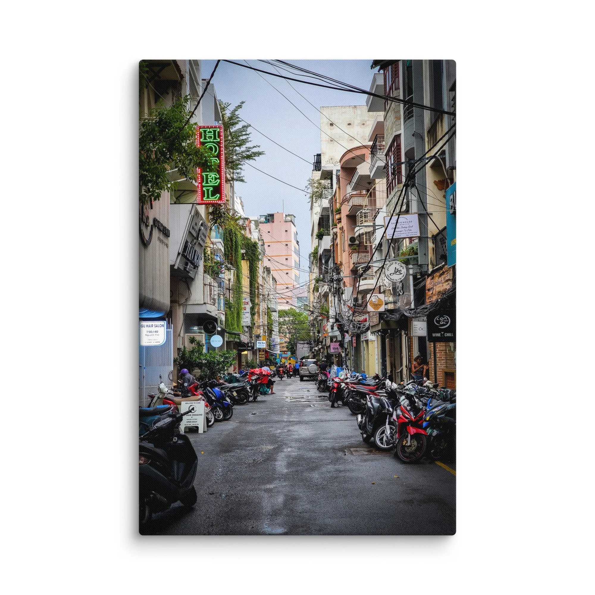 Atmospheric Hanoi Old Quarter narrow alley with neon hotel sign, vines, scooters and colorful buildings – authentic Vietnam travel photography canvas print wall art decor