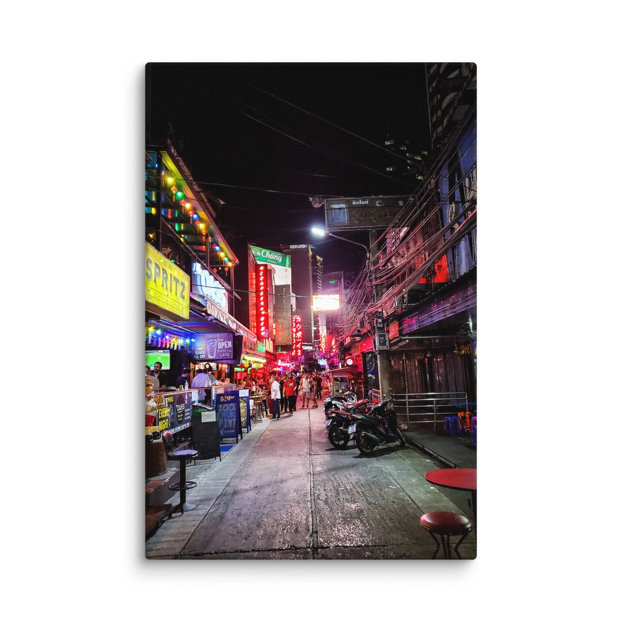 Vibrant Bangkok nightlife alley with neon signs like Chang & Oasis, crowds and wet street reflections – Thailand neon travel photography canvas print wall art decor