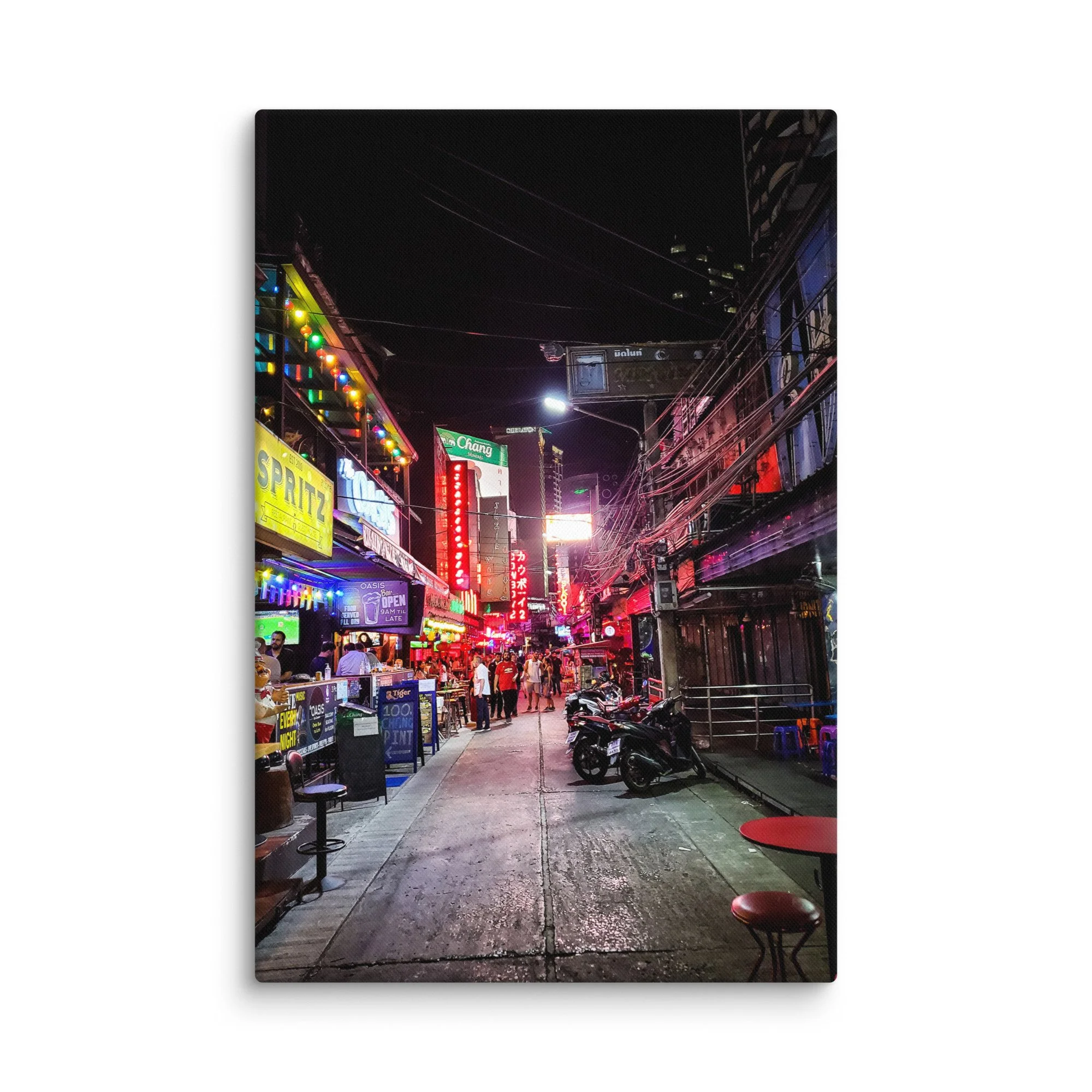 Vibrant Bangkok nightlife alley with neon signs like Chang & Oasis, crowds and wet street reflections – Thailand neon travel photography canvas print wall art decor