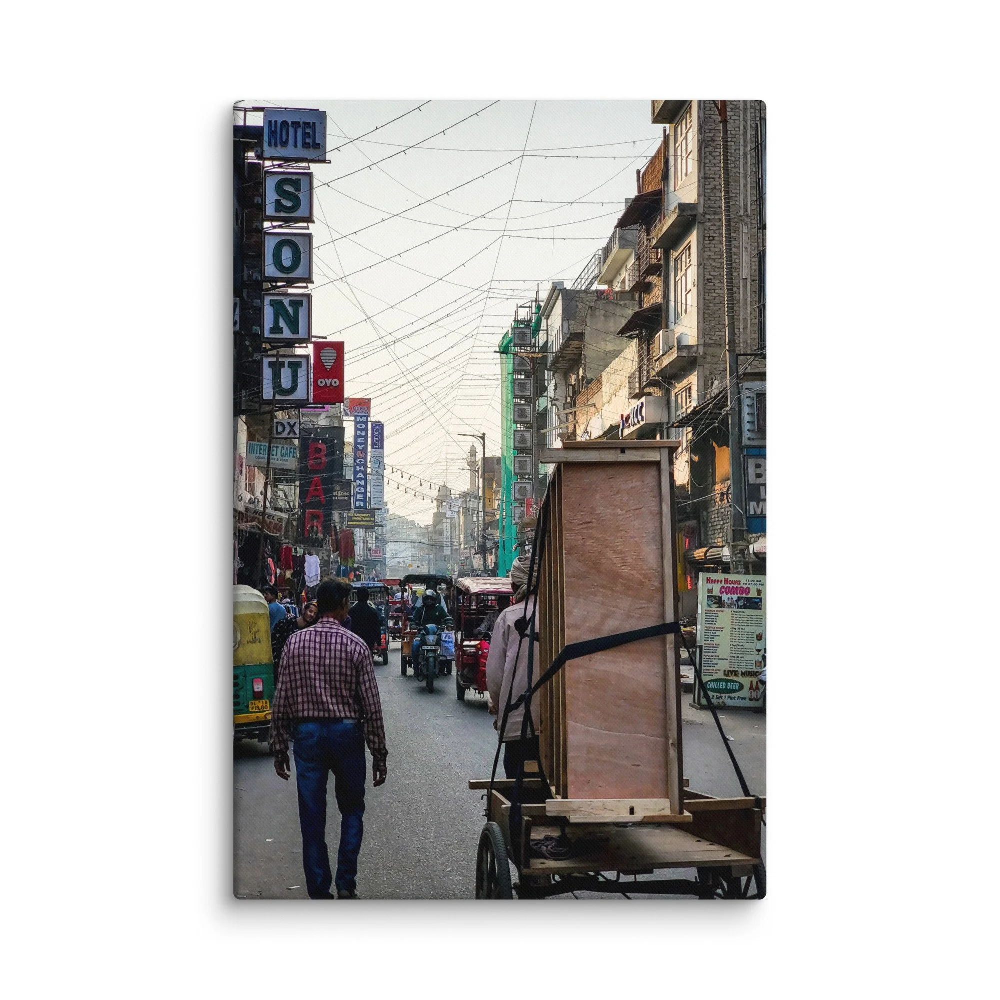 Vibrant Varanasi street with Hotel Sonu sign, overhead wires, carts, tuk-tuks and bustling life – authentic India travel photography canvas print wall art decor