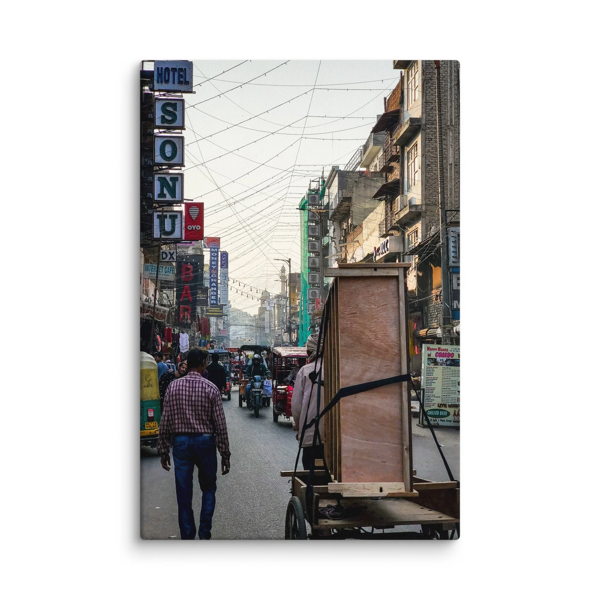 Vibrant Varanasi street with Hotel Sonu sign, overhead wires, carts, tuk-tuks and bustling life – authentic India travel photography canvas print wall art decor
