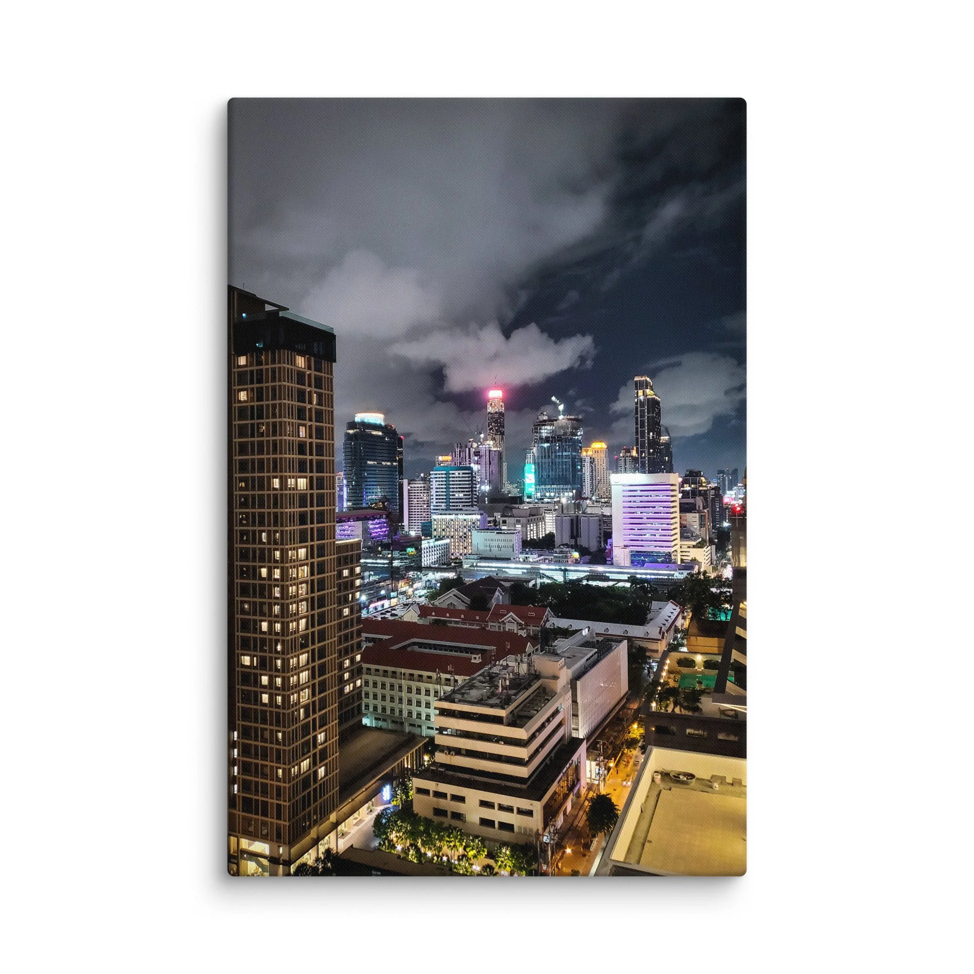Breathtaking nighttime Bangkok skyline from above with glowing towers, skyscrapers and city lights under cloudy sky – Thailand urban travel photography canvas print wall art decor
