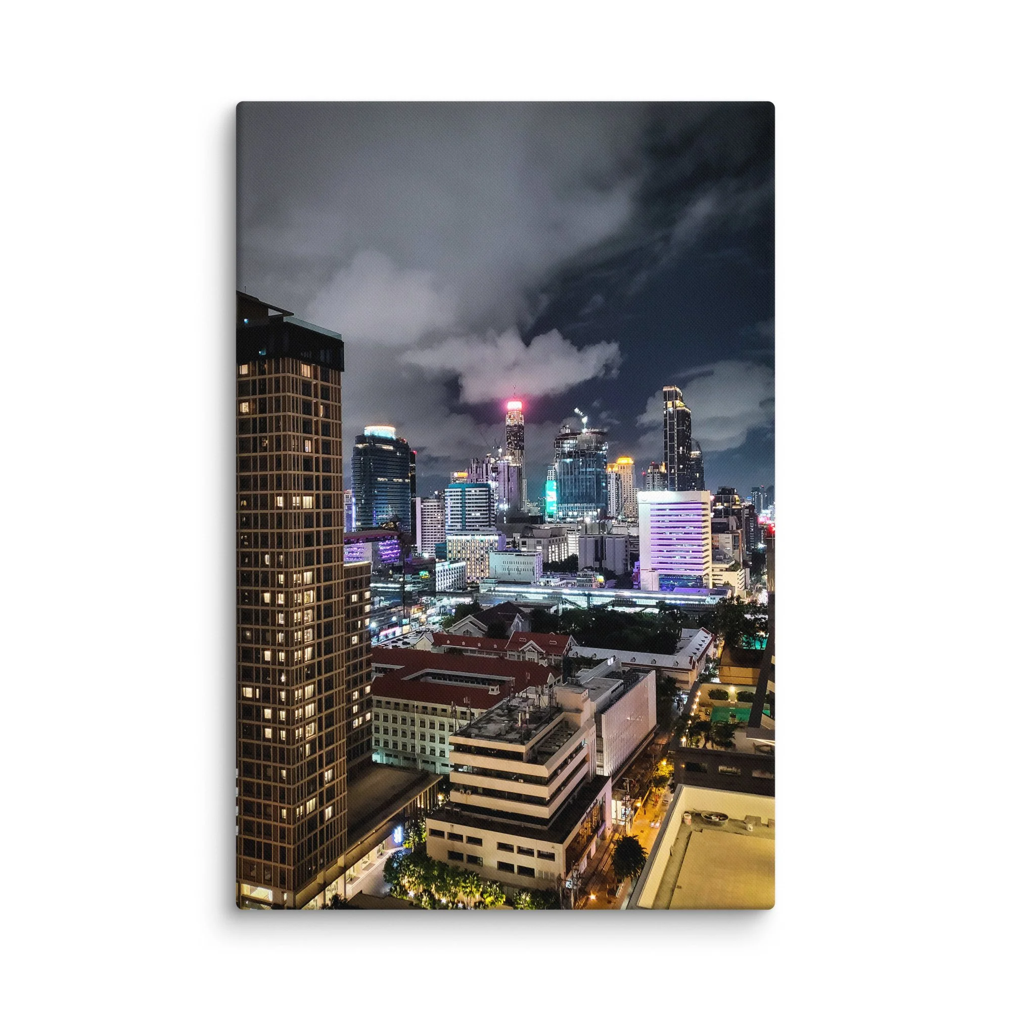 Breathtaking nighttime Bangkok skyline from above with glowing towers, skyscrapers and city lights under cloudy sky – Thailand urban travel photography canvas print wall art decor