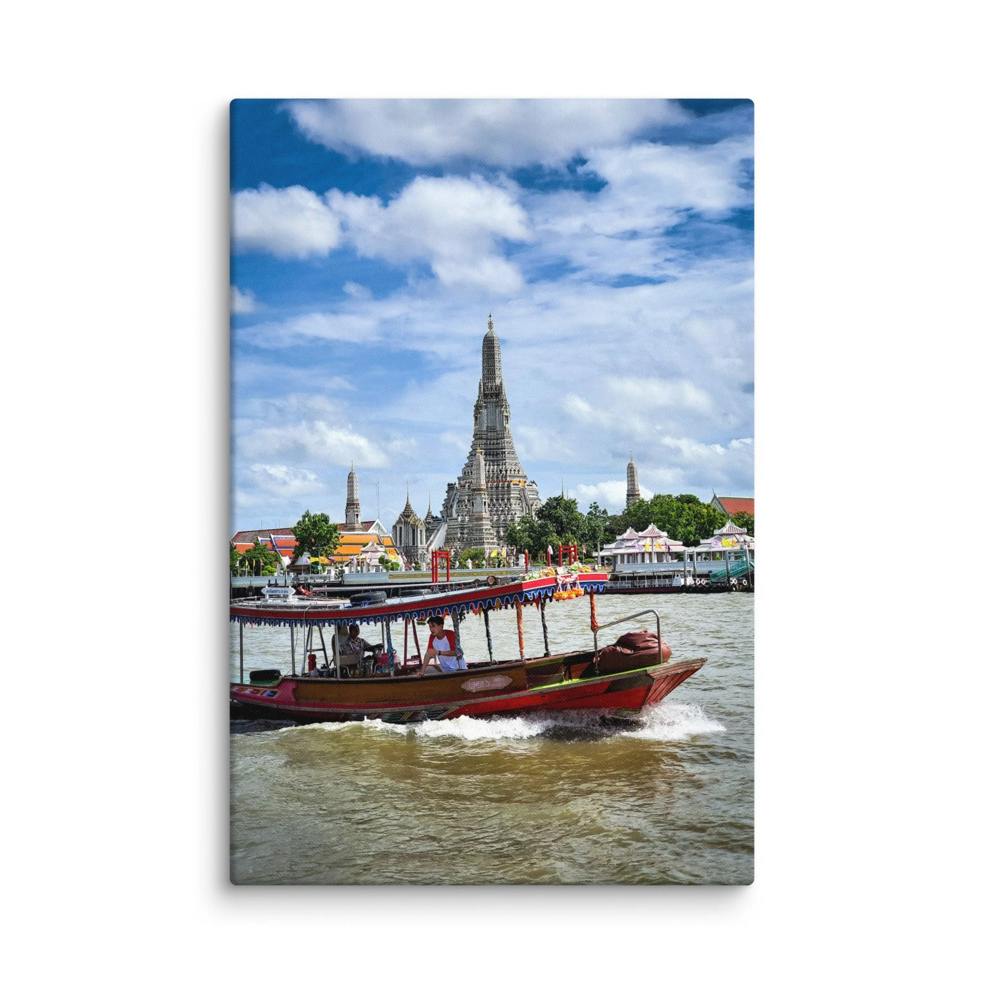 Longtail boat on Chao Phraya River with majestic Wat Arun temple spire under blue sky – iconic Bangkok Thailand travel photography canvas print wall art decor