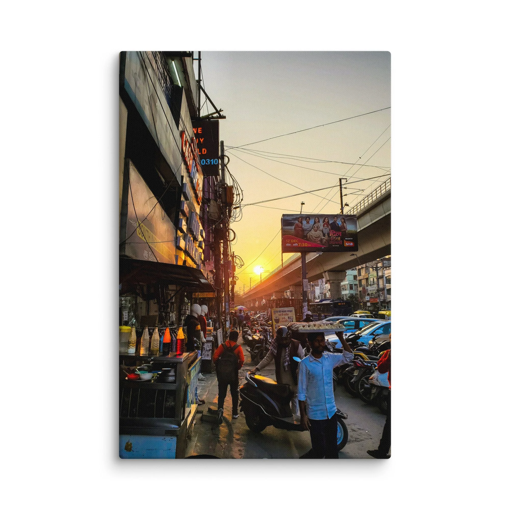 Golden sunset over bustling Delhi Paharganj street with shop signs, overhead wires, scooters and crowds – authentic India travel photography canvas print wall art decor