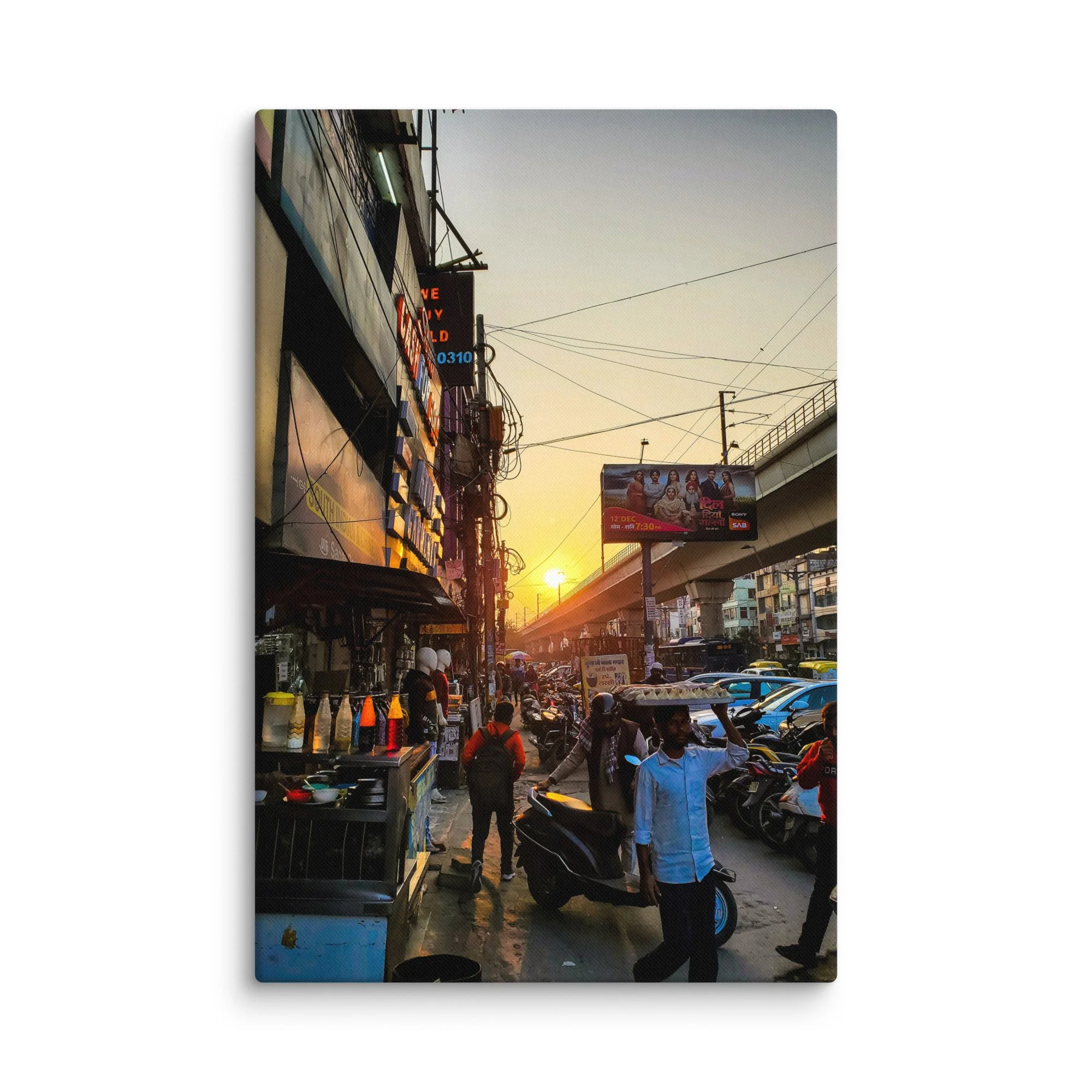 Golden sunset over bustling Delhi Paharganj street with shop signs, overhead wires, scooters and crowds – authentic India travel photography canvas print wall art decor
