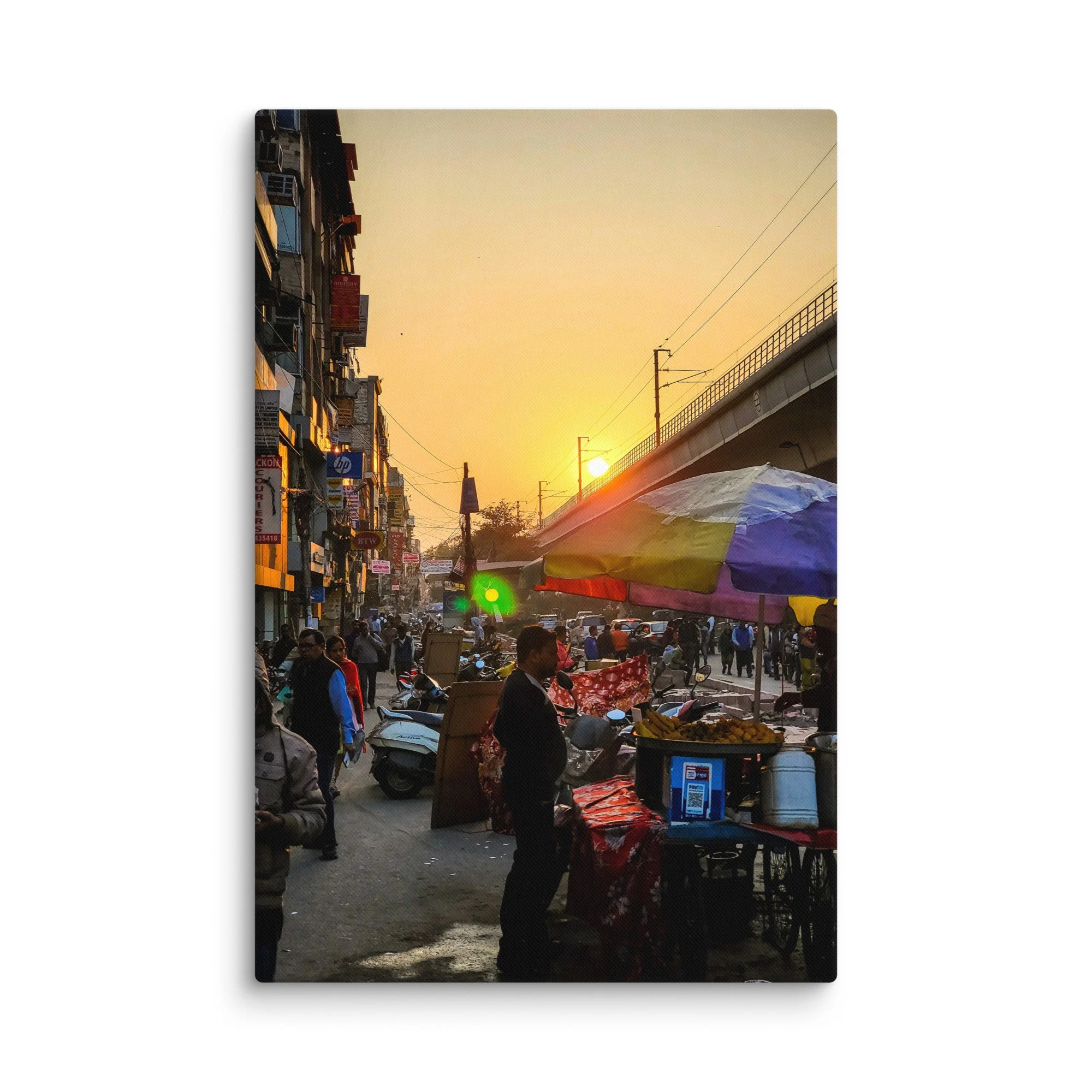 Golden sunset over bustling Delhi Paharganj street with shop signs, overhead wires, scooters and crowds – authentic India travel photography canvas print wall art decor