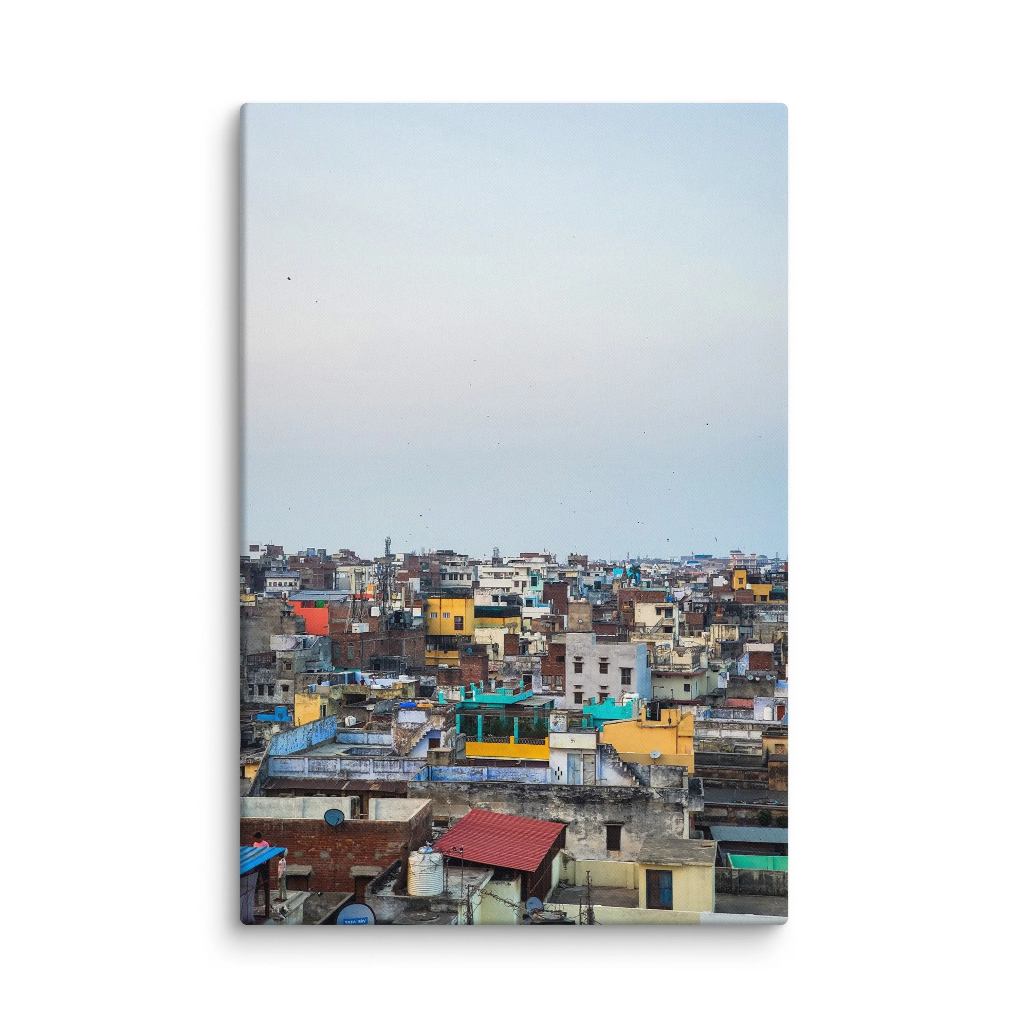 Colorful Varanasi rooftop skyline with densely packed buildings under hazy blue sky – authentic India urban travel photography canvas print wall art decor