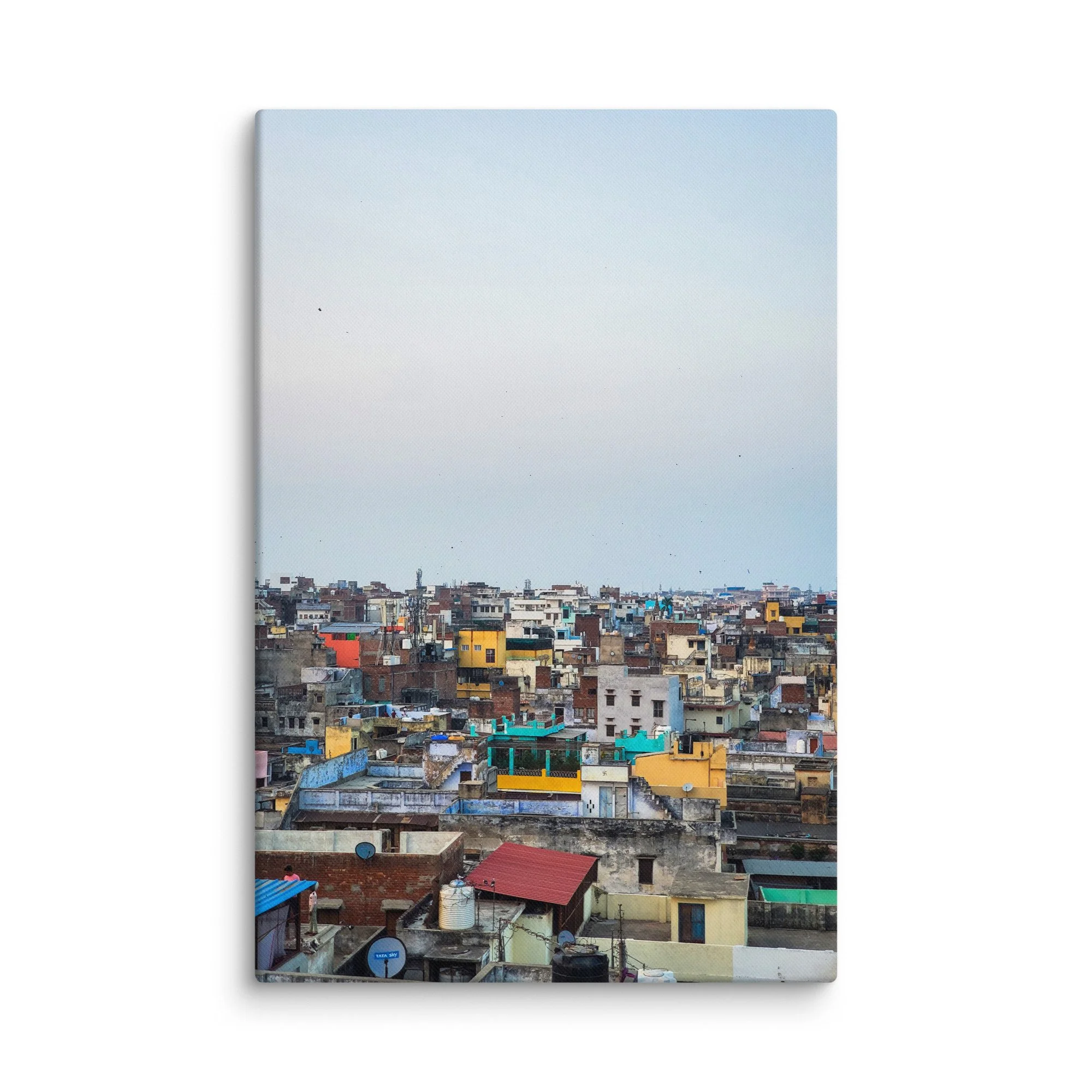 Colorful Varanasi rooftop skyline with densely packed buildings under hazy blue sky – authentic India urban travel photography canvas print wall art decor