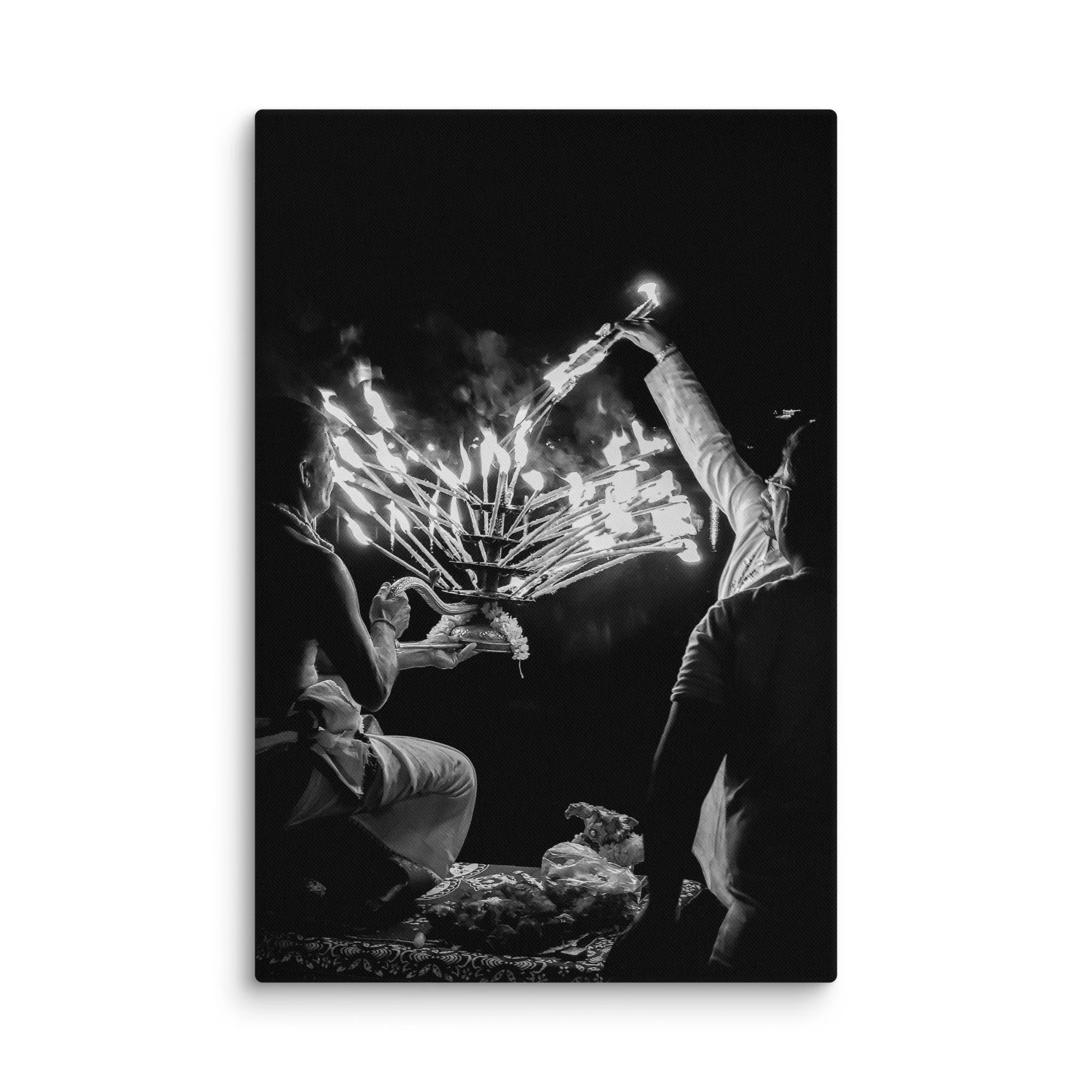 Black-and-white Varanasi Ganges Aarti with priest holding multi-flame lamp and incense smoke – sacred India spiritual travel photography canvas print wall art decor