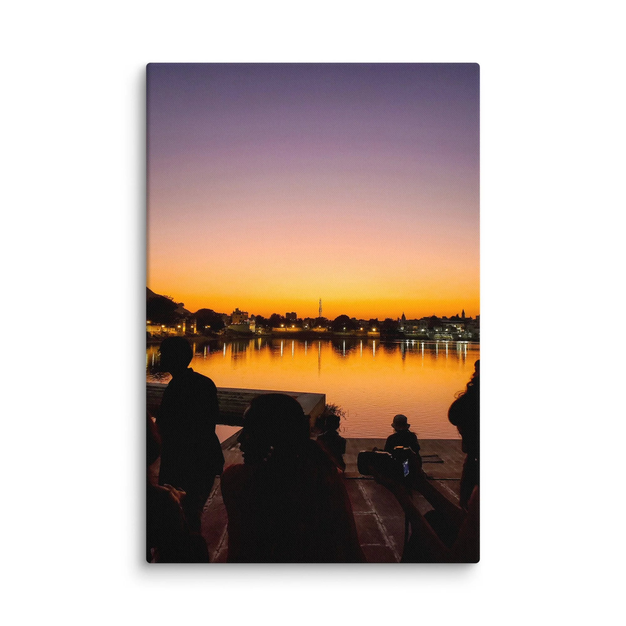 Serene sunset over Pushkar Lake with pilgrims on ghats, birds flying and warm orange sky reflection – sacred Rajasthan India travel photography canvas print wall art decor