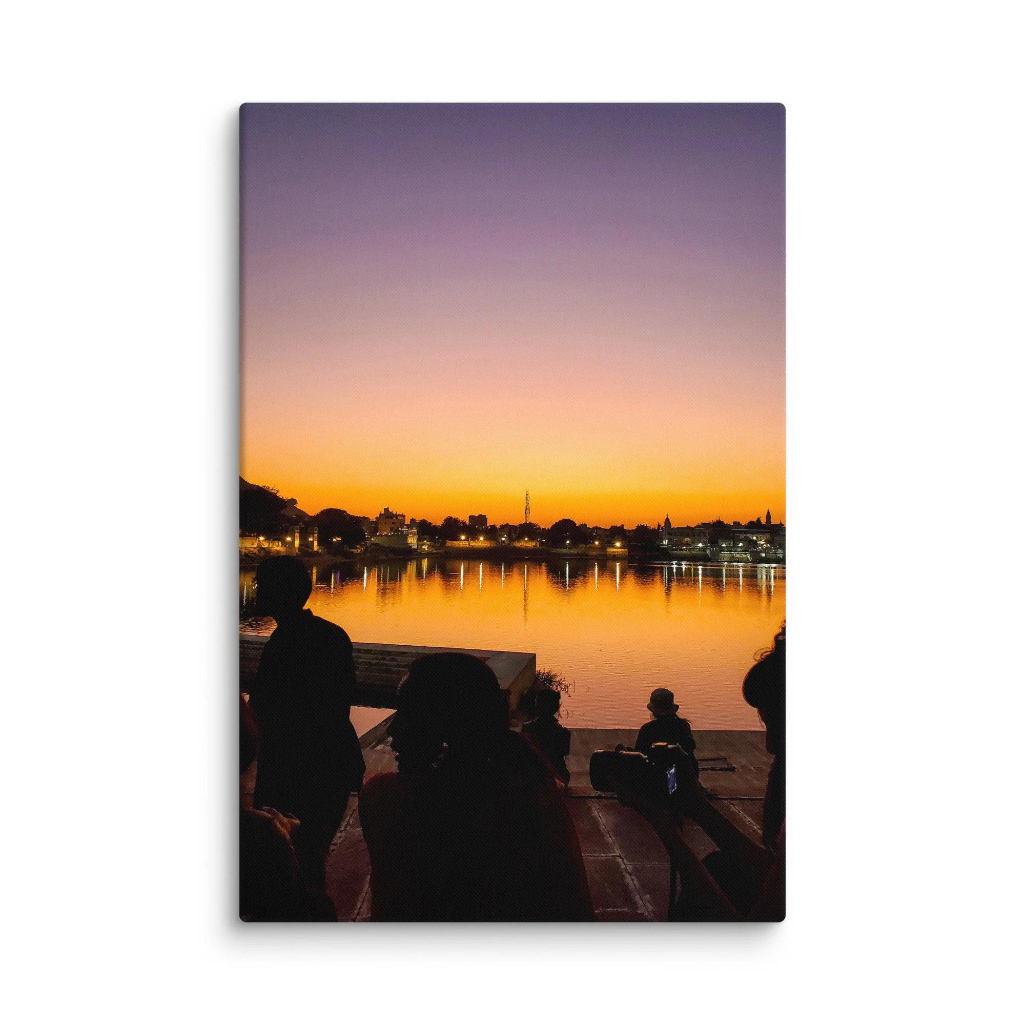Serene sunset over Pushkar Lake with pilgrims on ghats, birds flying and warm orange sky reflection – sacred Rajasthan India travel photography canvas print wall art decor