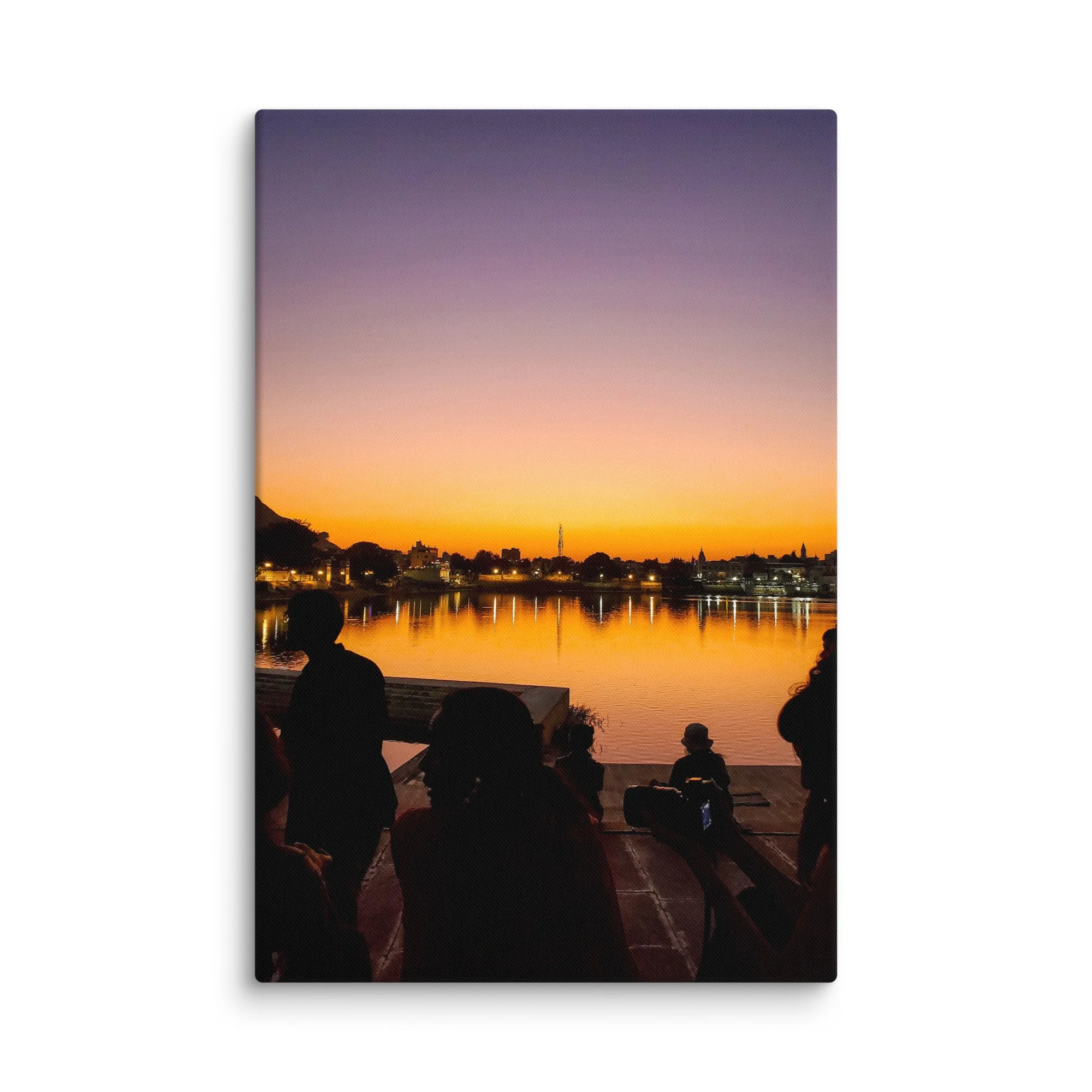Serene sunset over Pushkar Lake with pilgrims on ghats, birds flying and warm orange sky reflection – sacred Rajasthan India travel photography canvas print wall art decor