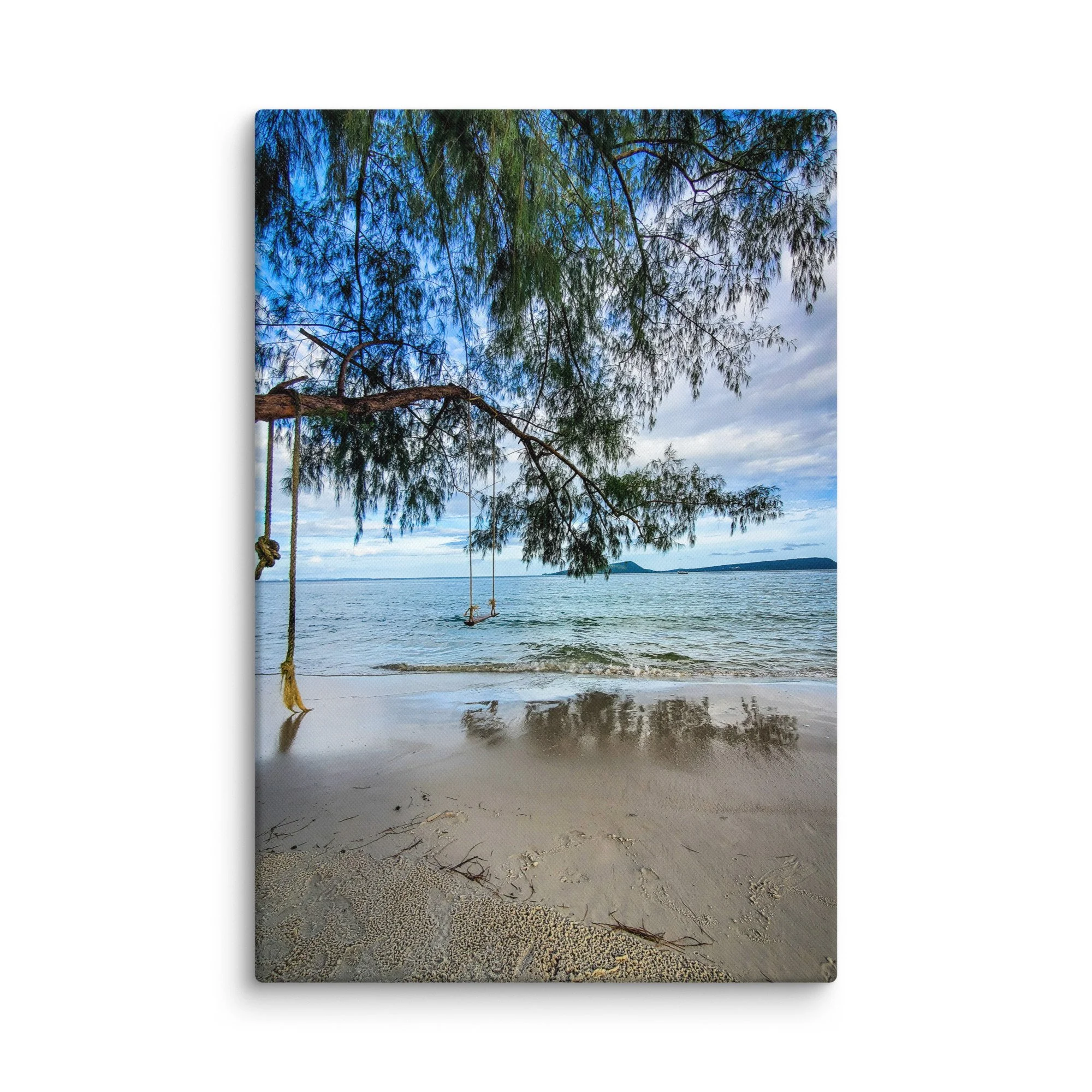 Serene rope swing on Cambodian island beach under casuarina tree with turquoise sea and distant hills – tropical travel photography canvas print wall art decor