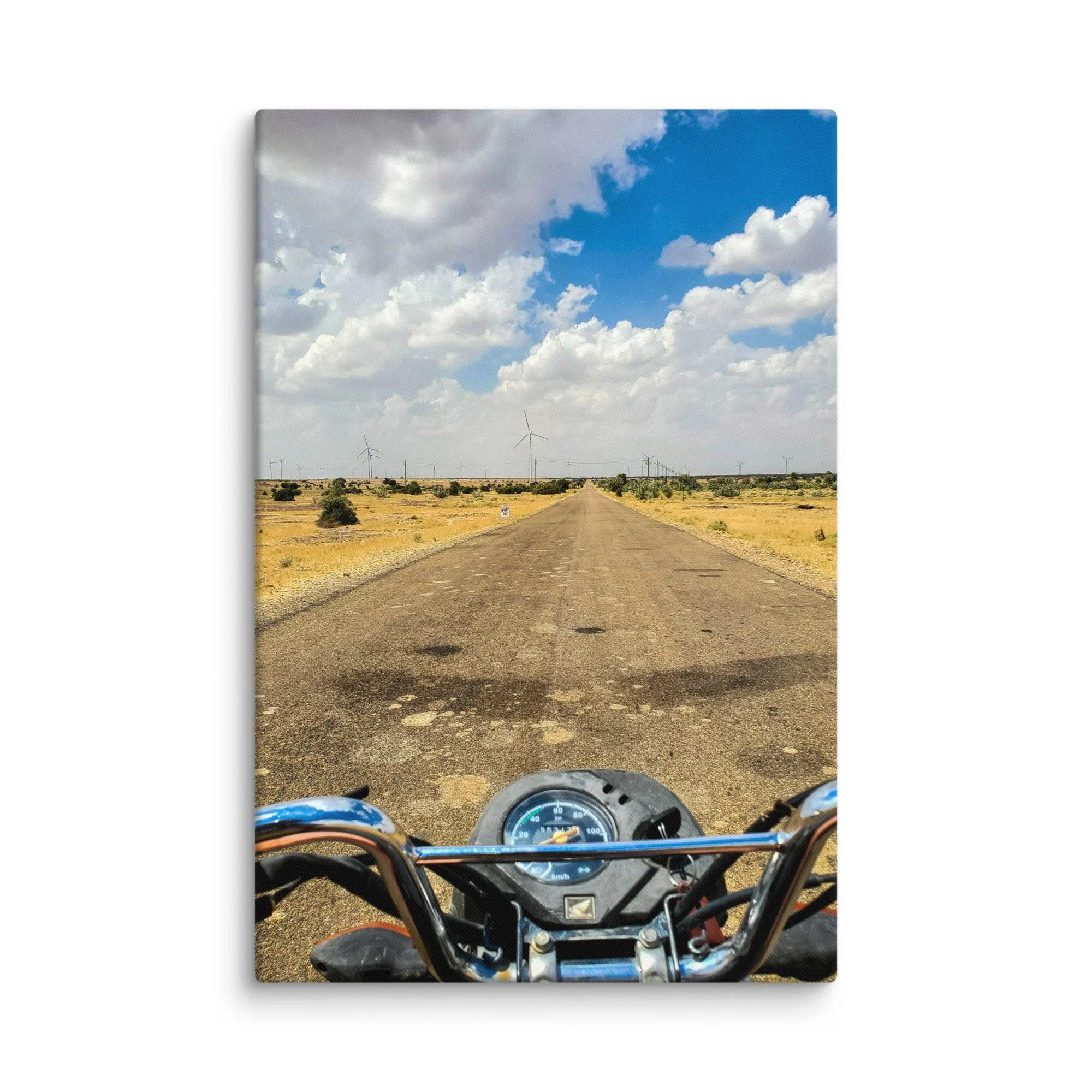 First-person motorcycle view on endless desert highway in Rann of Kutch, India with wind turbines and blue sky – adventure travel photography canvas print wall art decor