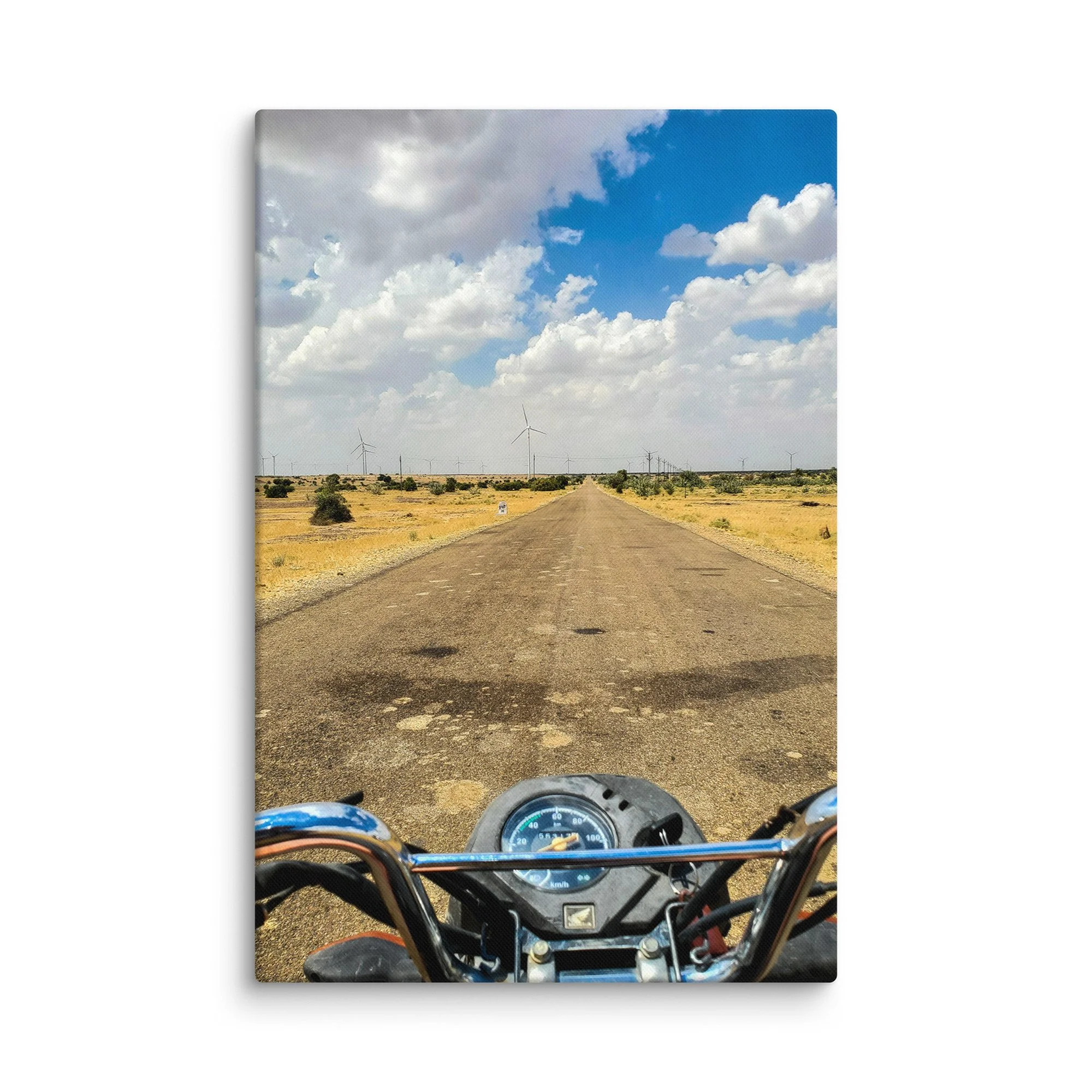 First-person motorcycle view on endless desert highway in Rann of Kutch, India with wind turbines and blue sky – adventure travel photography canvas print wall art decor