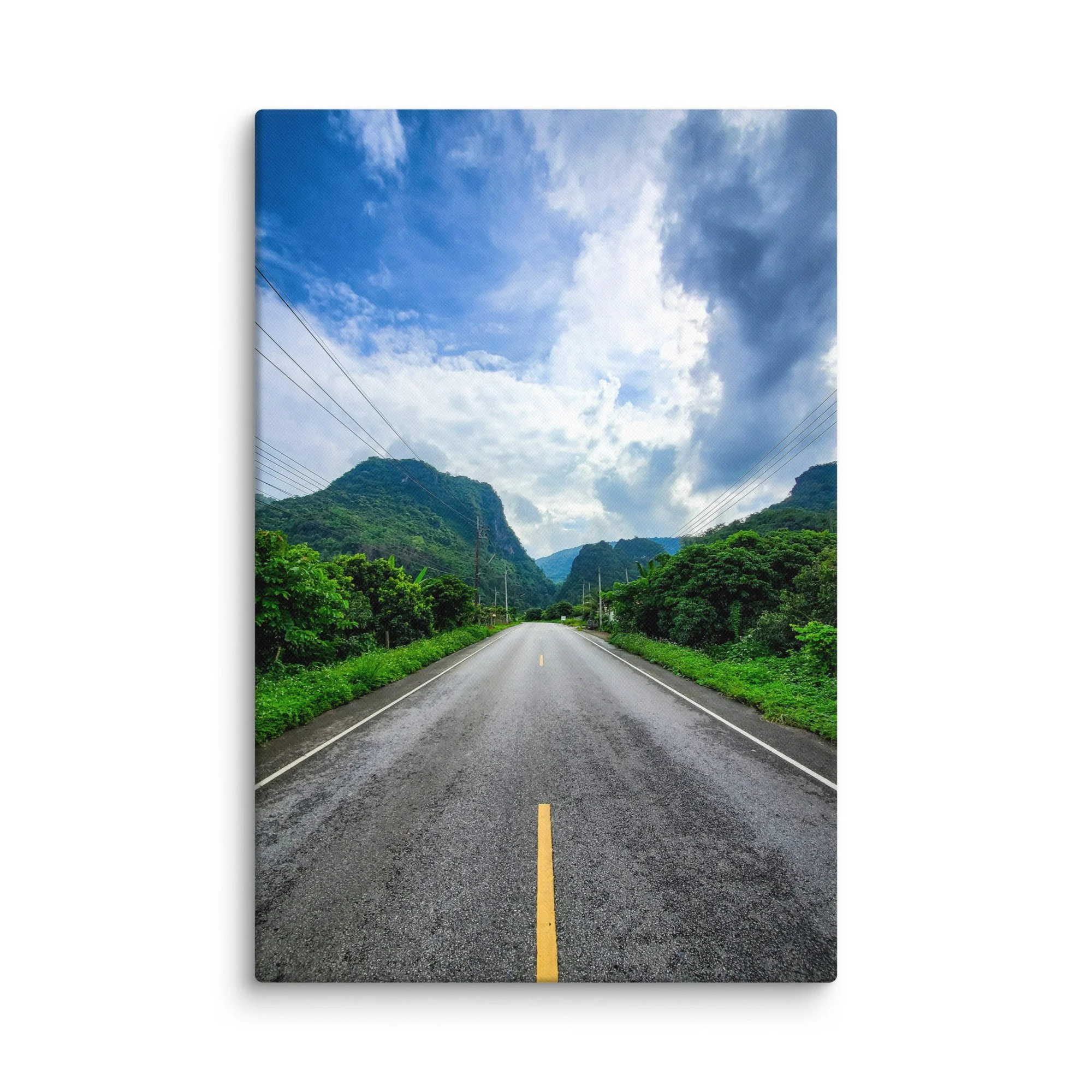 Scenic mountain road in northern Vietnam (Hà Giang) lined with lush greenery and dramatic karst peaks under blue sky – adventure travel photography canvas print wall art decor